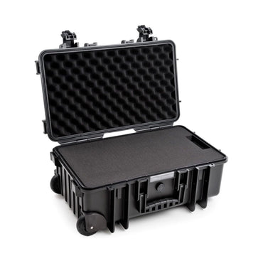 B&W 6600 Case open with foam-lined lid, base inserts, and corner wheels.