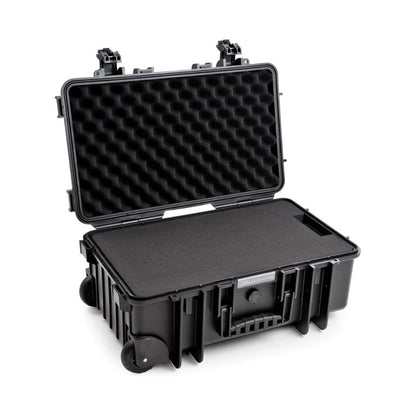 B&W 6600 Case open with foam-lined lid, base inserts, and corner wheels.