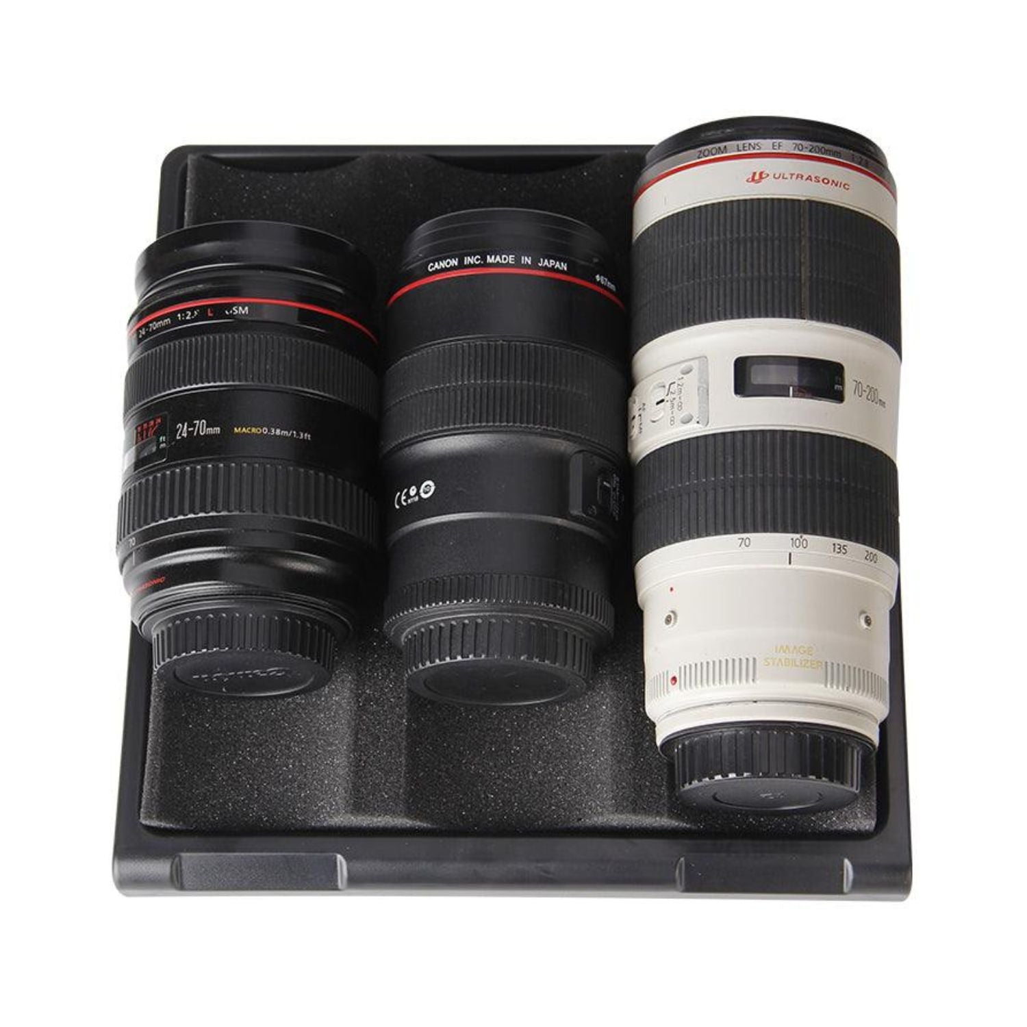 Dry cabinet interior with multiple camera lenses resting on foam tray