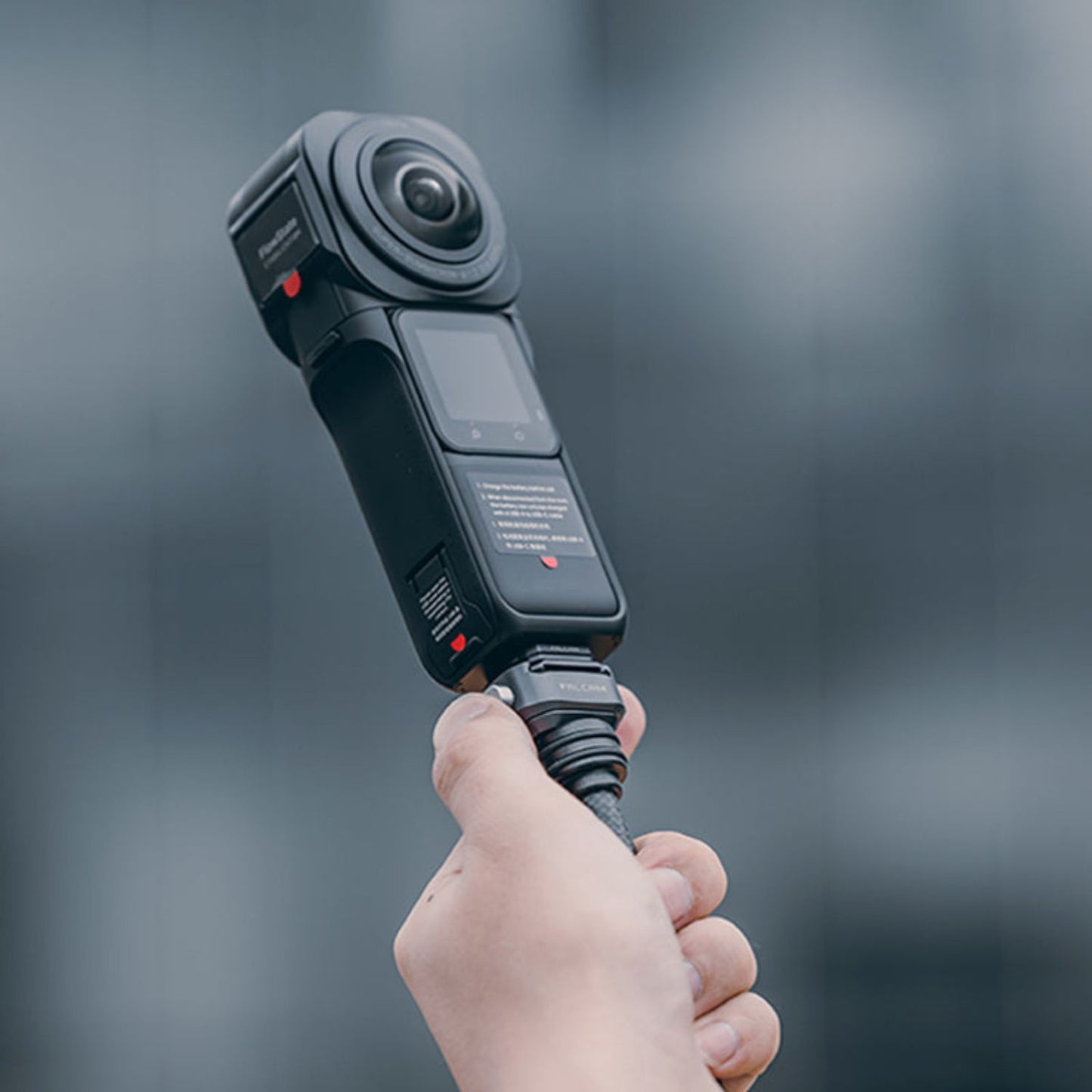 Camera quick release mount attached to a camera body, dark gray