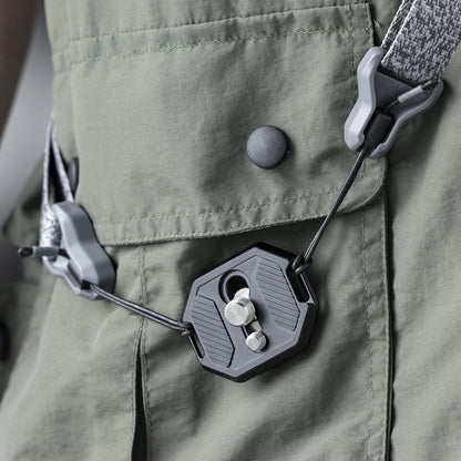 FALCAM F38 base plate clipped to a green fabric bag with adjustment knobs