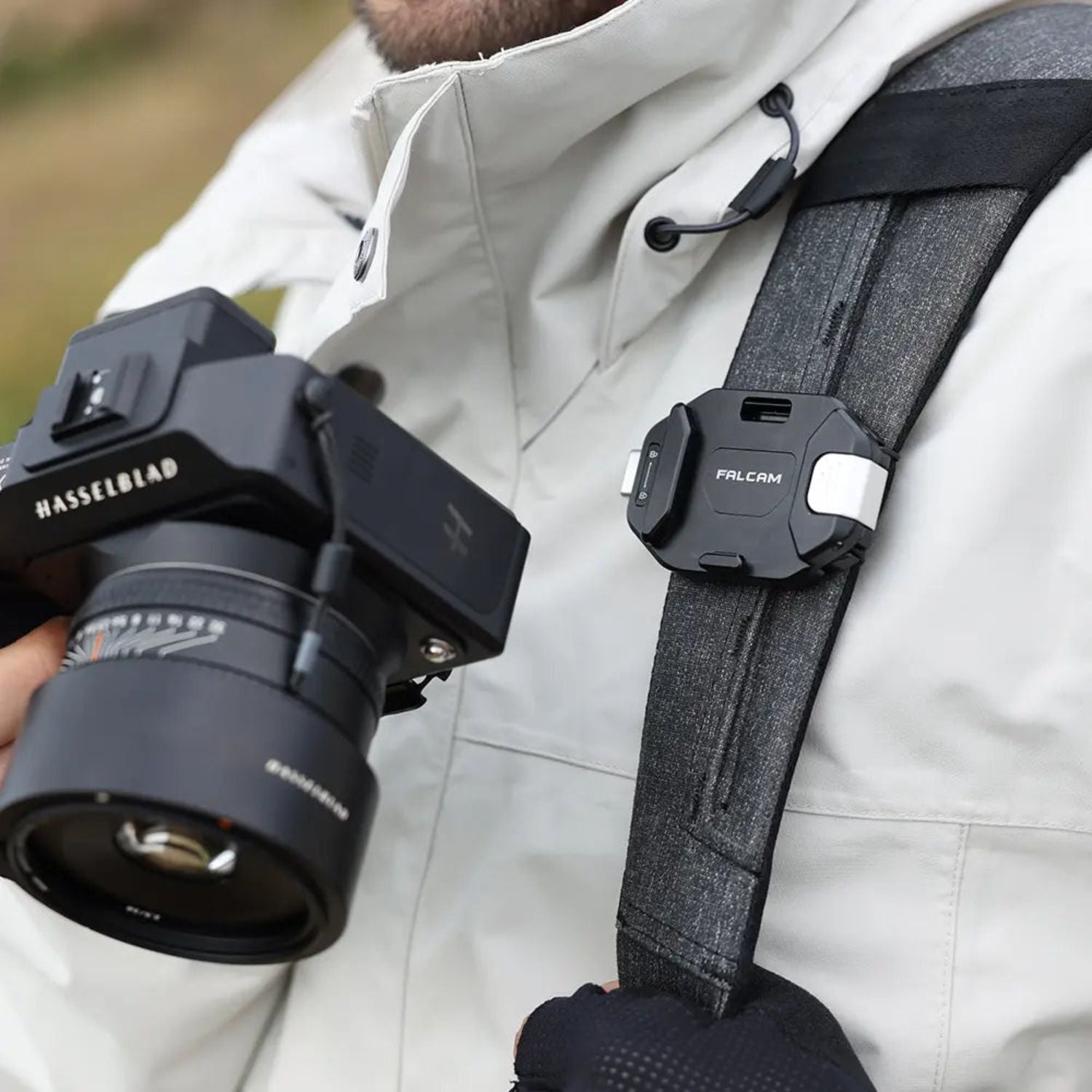 F38 quick release camera backpack strap clip on gray strap, securing a camera rig