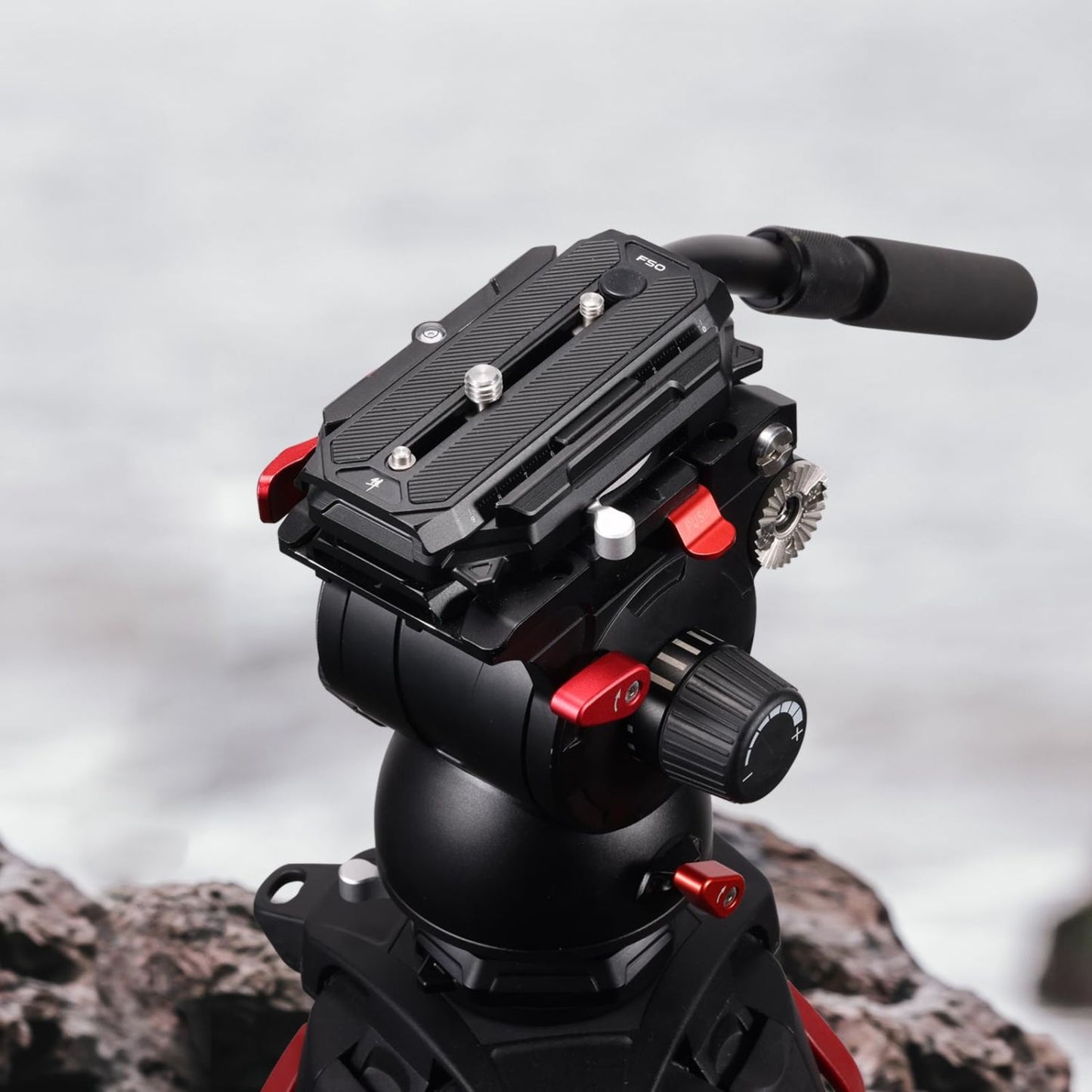 Camera quick release base with square plate, black body and red locking hardware