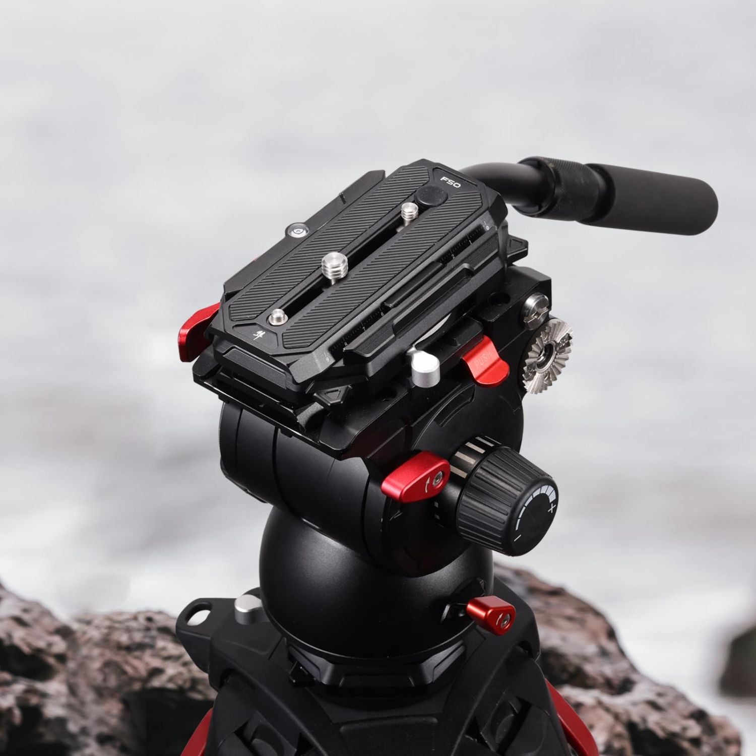 Camera quick release base with square plate, black body and red locking hardware
