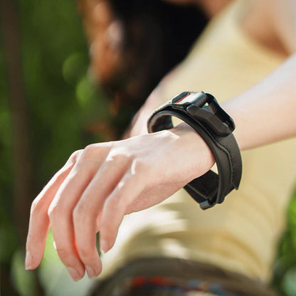 Black magnetic buckle wrist strap on a wrist