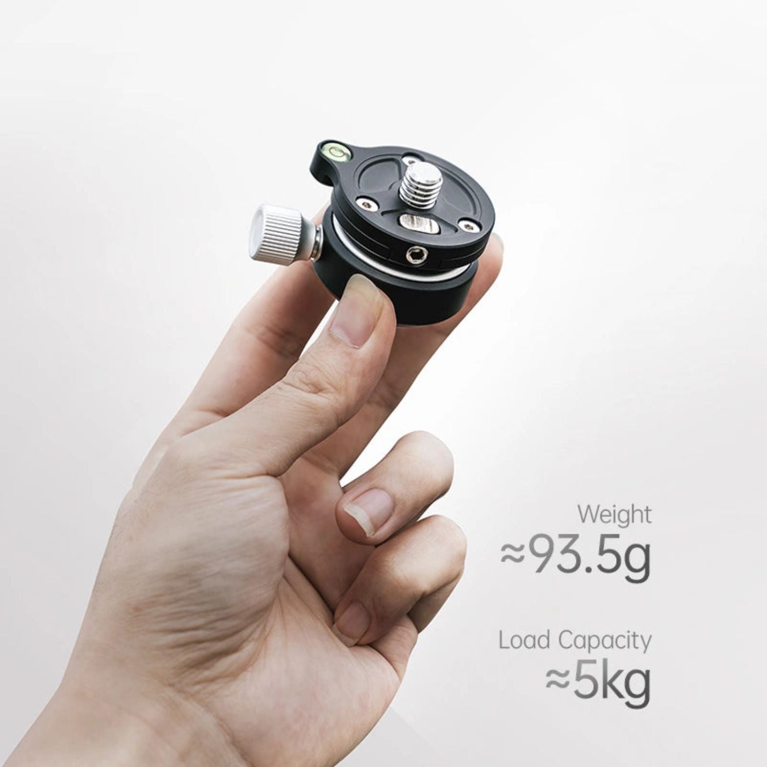 Black ball head with side knob and white knurled locking dial, held in hand