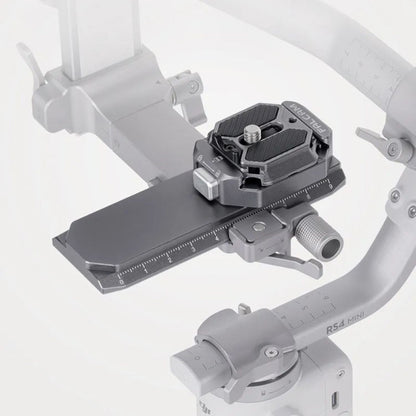 Quick-release rail clamp mounted on a gimbal handle, dark gray
