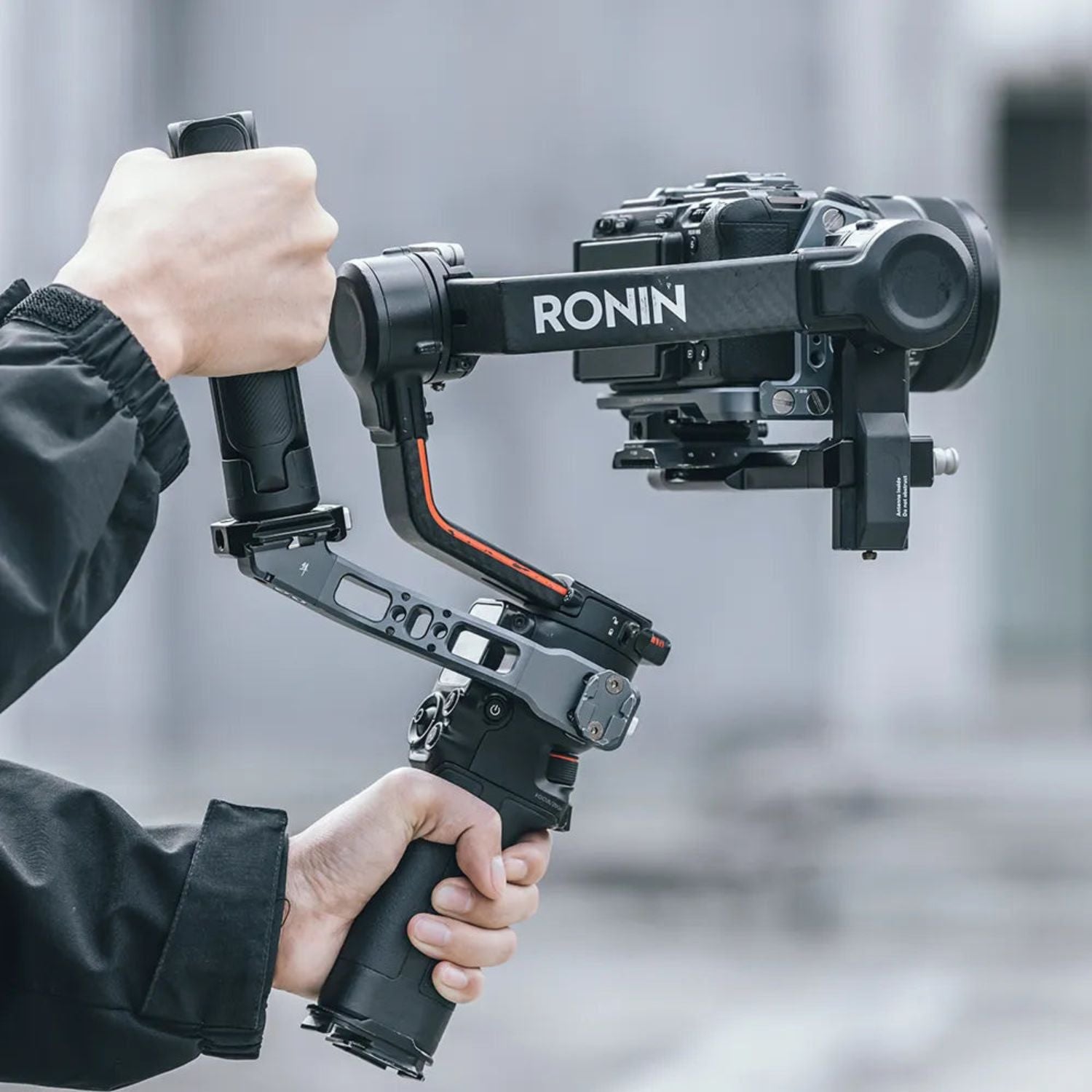 Desktop tripod with camera mounted, three legs extended from the center base