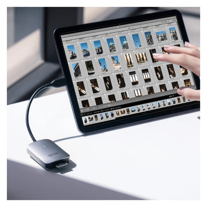 Lexar CFexpress Type A USB-C reader connected to device, light gray housing.