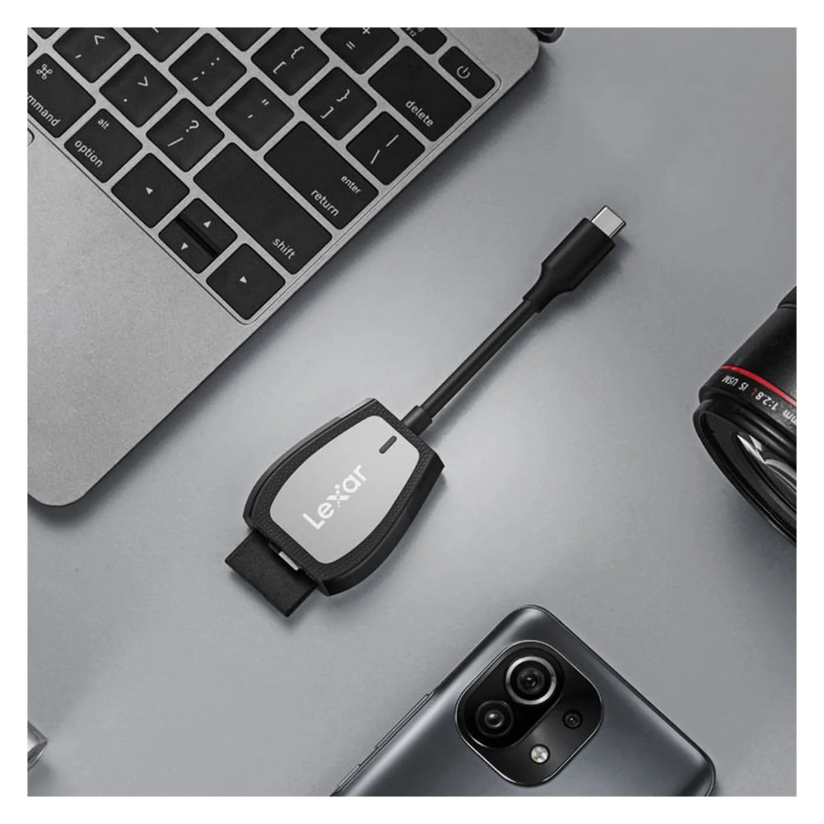 USB-C card reader connected by cable, black Lexar reader with dual slots