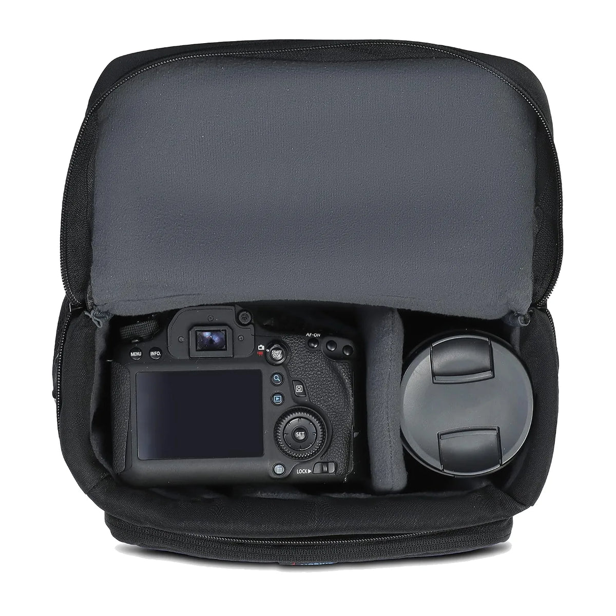 Mobius DSLR sling bag open, padded interior holding a camera and lens