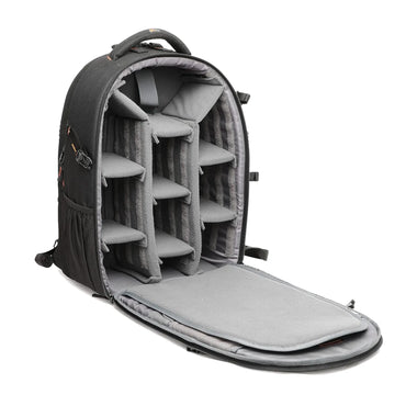 Black camera backpack opened to show padded foam compartments for gear