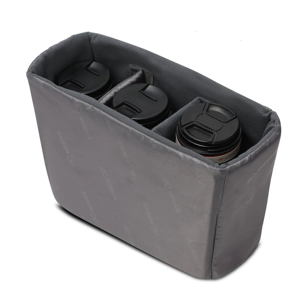 Gray sling bag open with padded lens slots and soft interior lining