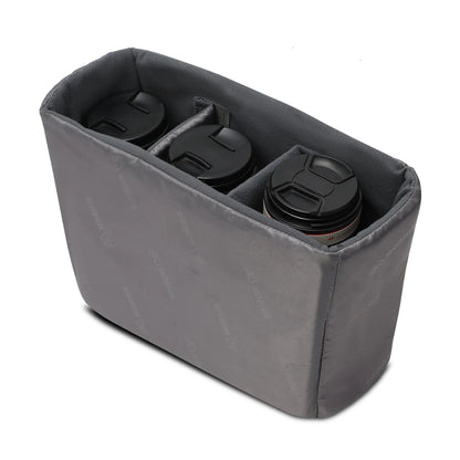 Gray sling bag open with padded lens slots and soft interior lining