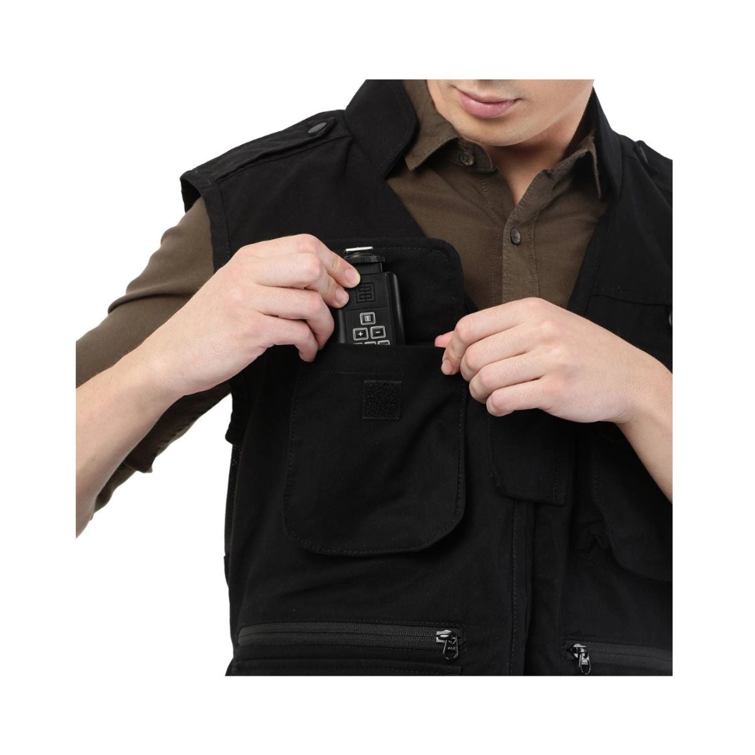 Black photographer's jacket close-up: flap pocket with zipper and concealed device pouch