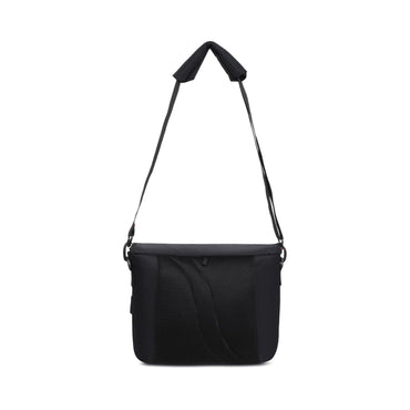 Black camera lens sling bag with adjustable shoulder strap and side handle loops