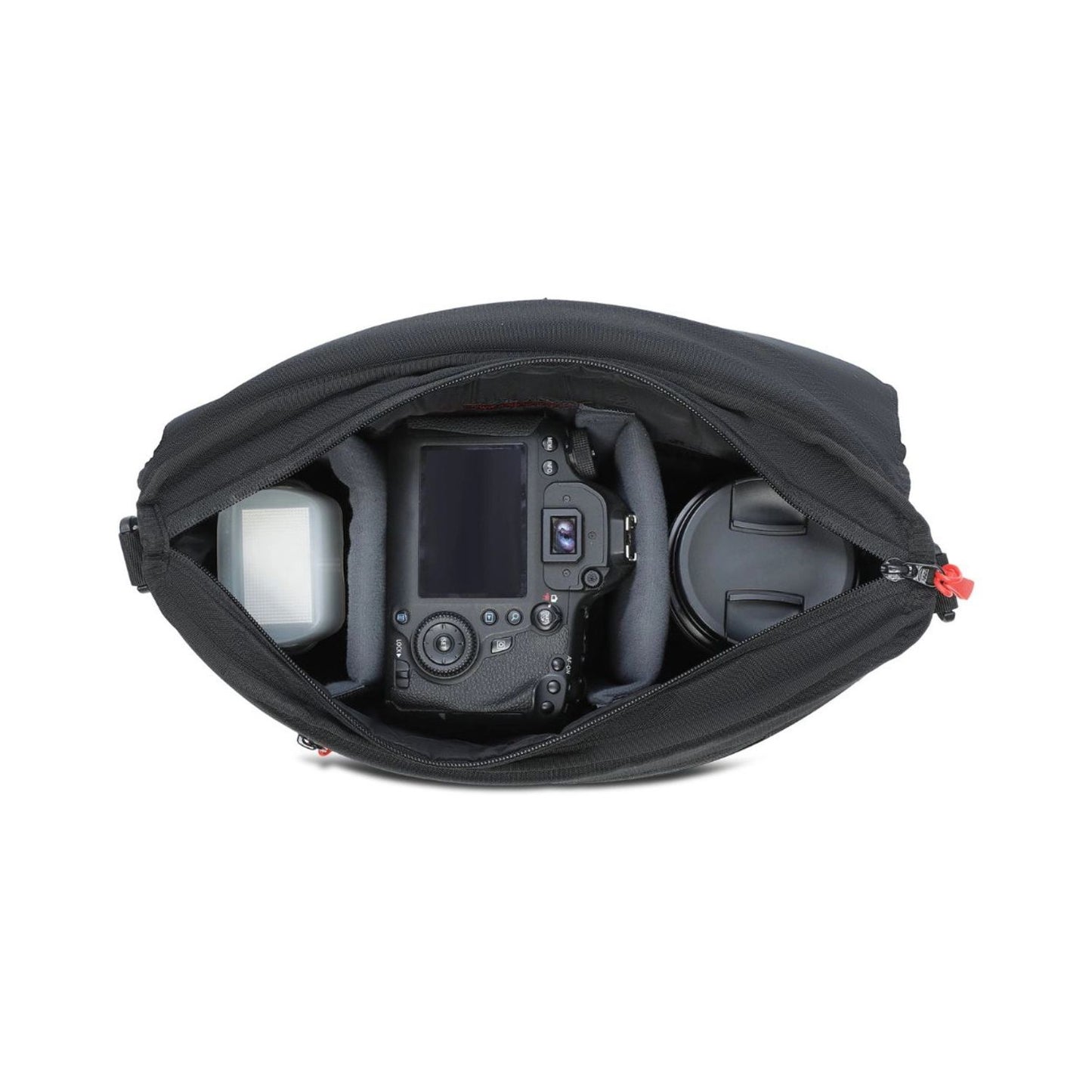 Open black sling bag interior with camera body, lens, and accessory pockets