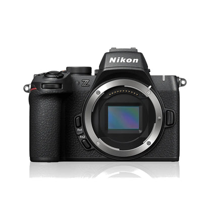 Black mirrorless camera with viewfinder and LCD screen, front three-quarter view