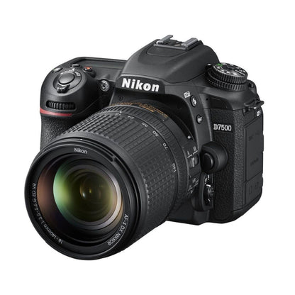 DSLR camera, side angle with mode dial and grip, 18-140mm lens attached
