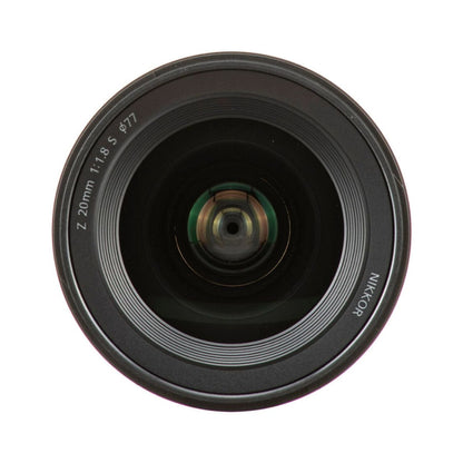 NIKKOR Z 20mm f/1.8 S lens front element close-up, glass optics facing camera