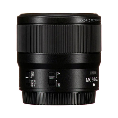 NIKKOR MC 50/2.8 macro lens side view with focus-mode switches and markings