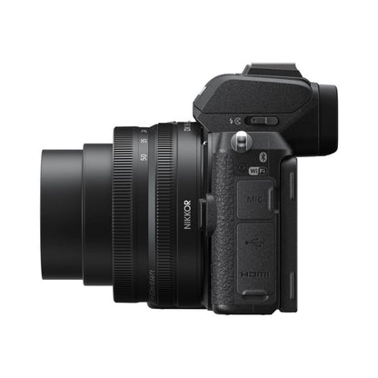Mirrorless camera side view with WiFi, HDMI, MIC ports and lens attached