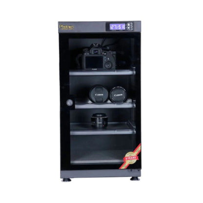 Dry cabinet with glass door showing camera and lens storage on adjustable shelves