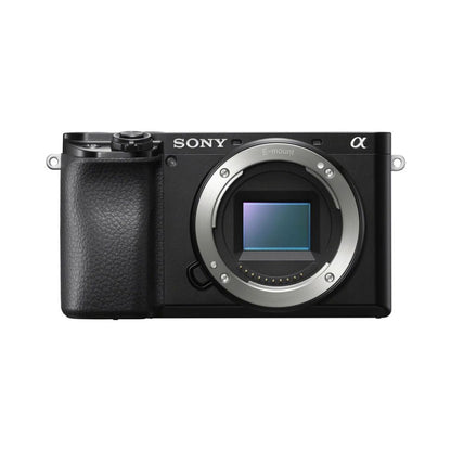 Sony a6100 mirrorless camera front view with E-mount lens bay and grip