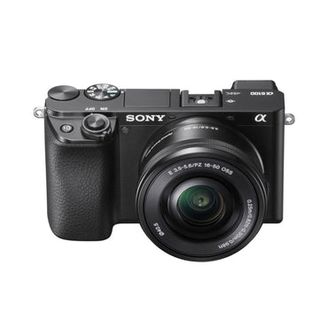 Mirrorless camera front view with 16–50mm lens and textured grip, black