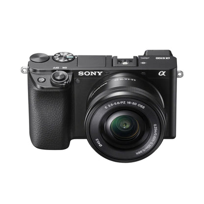 Mirrorless camera front view with 16–50mm lens and textured grip, black
