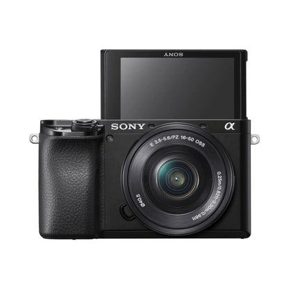 Mirrorless camera with 16-50mm lens and rear LCD screen