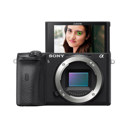 a6600 mirrorless camera with LCD screen showing face portrait; black body