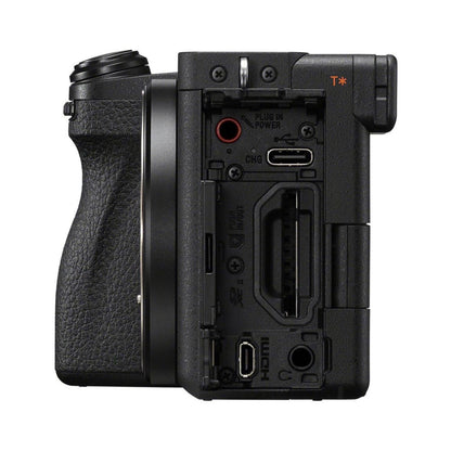 Rear I/O ports and battery compartment on black mirrorless camera body