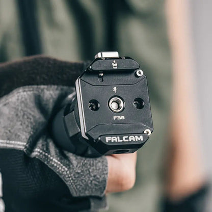 Ulanzi Falcam F38 quick release kit on black jacket, front view with F38 label