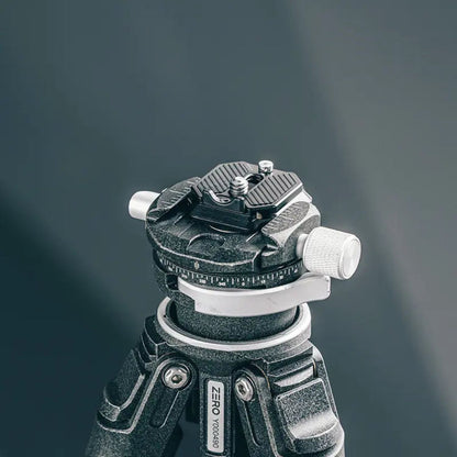 Quick release top plate with knurled knob on tripod head, black and silver metal